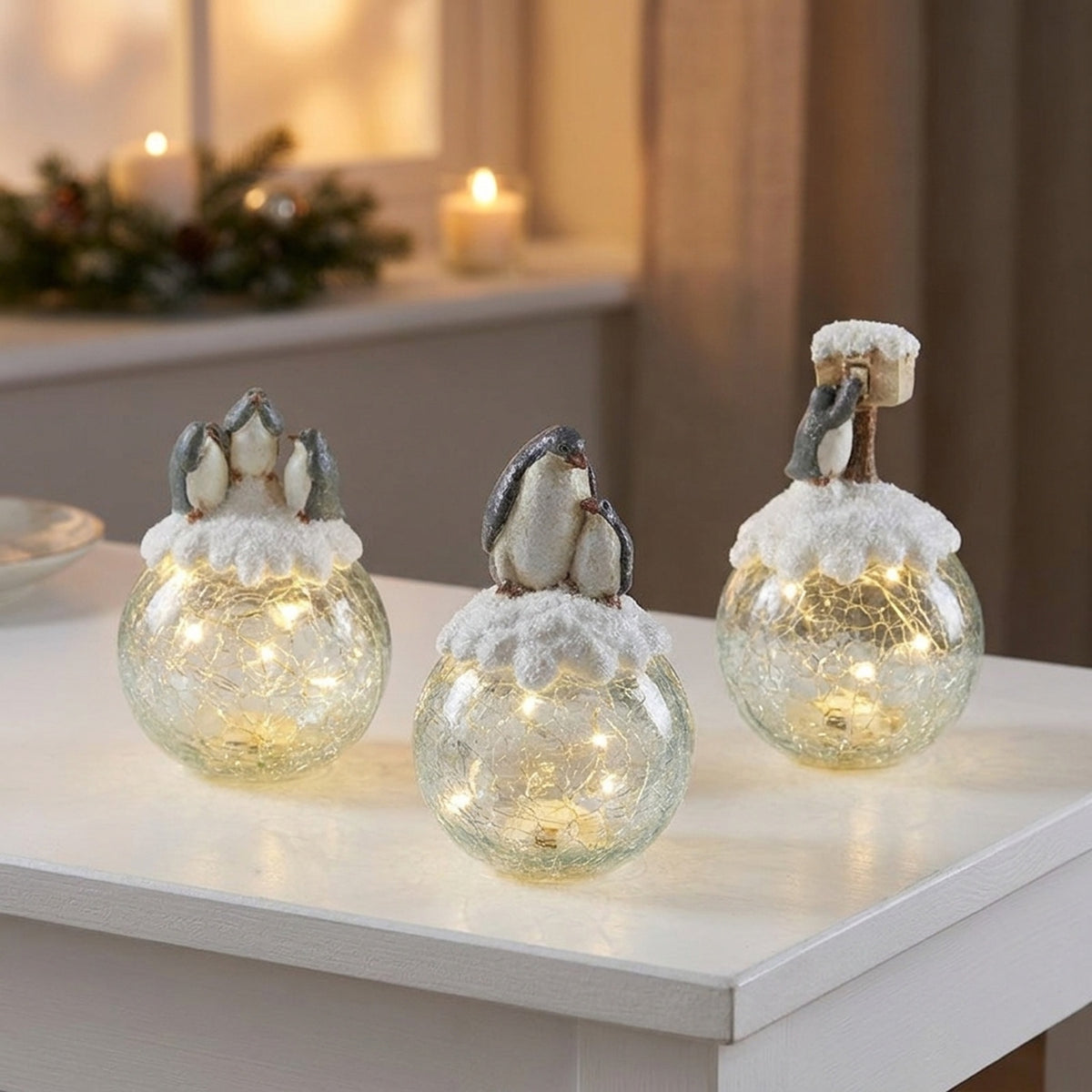 Three Penguins On Light Up Globes Ornament
