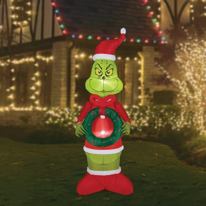 Mischievous Grinch Holding Wreath Inflatable