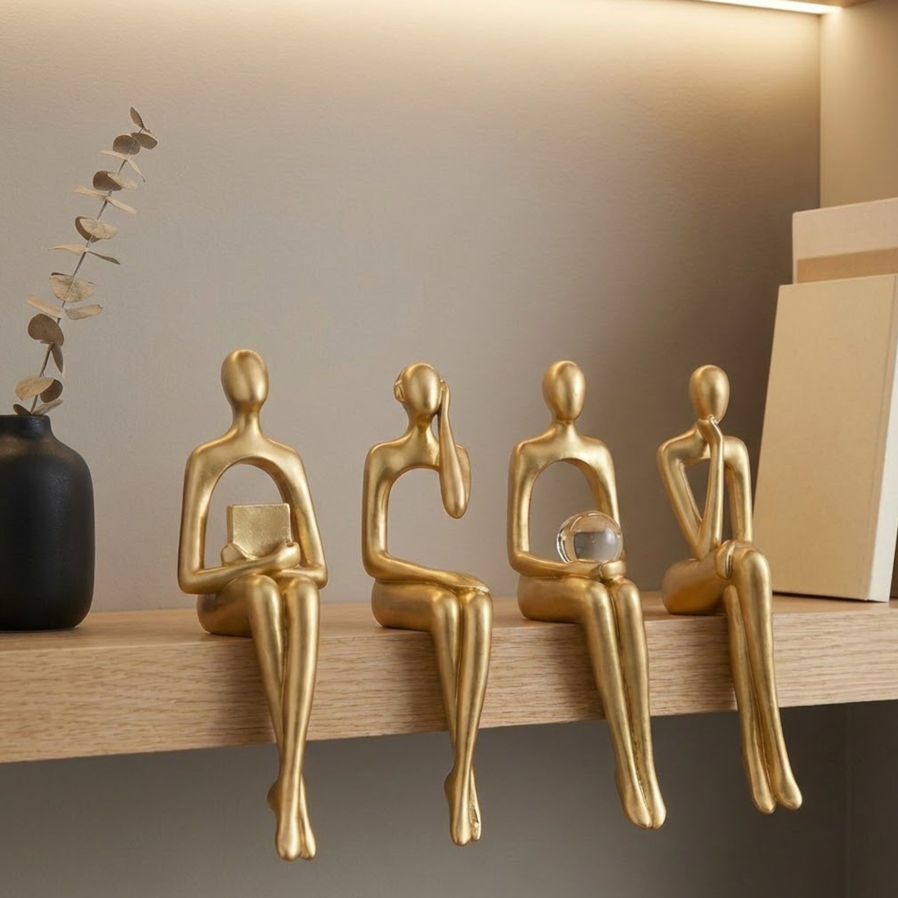 Aureate Four Sitting Abstract Figurines